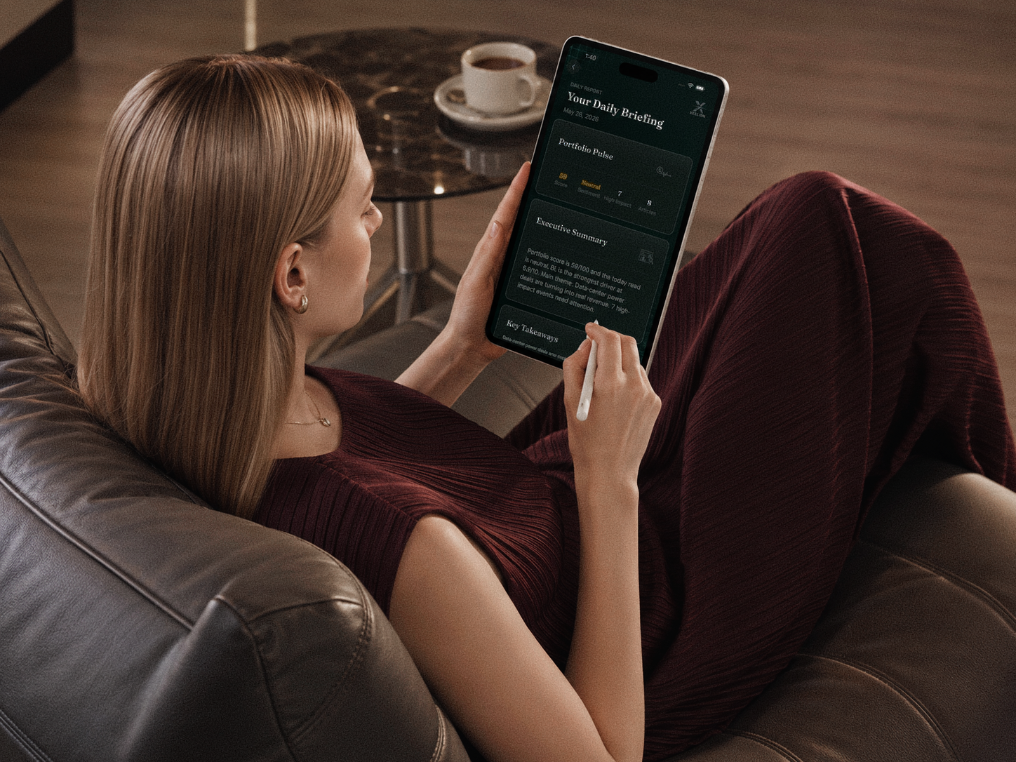 A reader reviewing an Xcelion daily briefing on a tablet